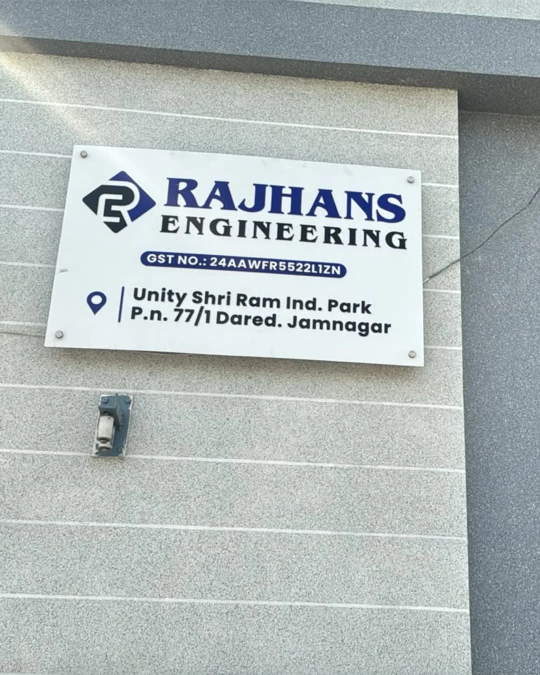 The Rajhans Engineering nameboard on the unit wall at Dared, Jamnagar