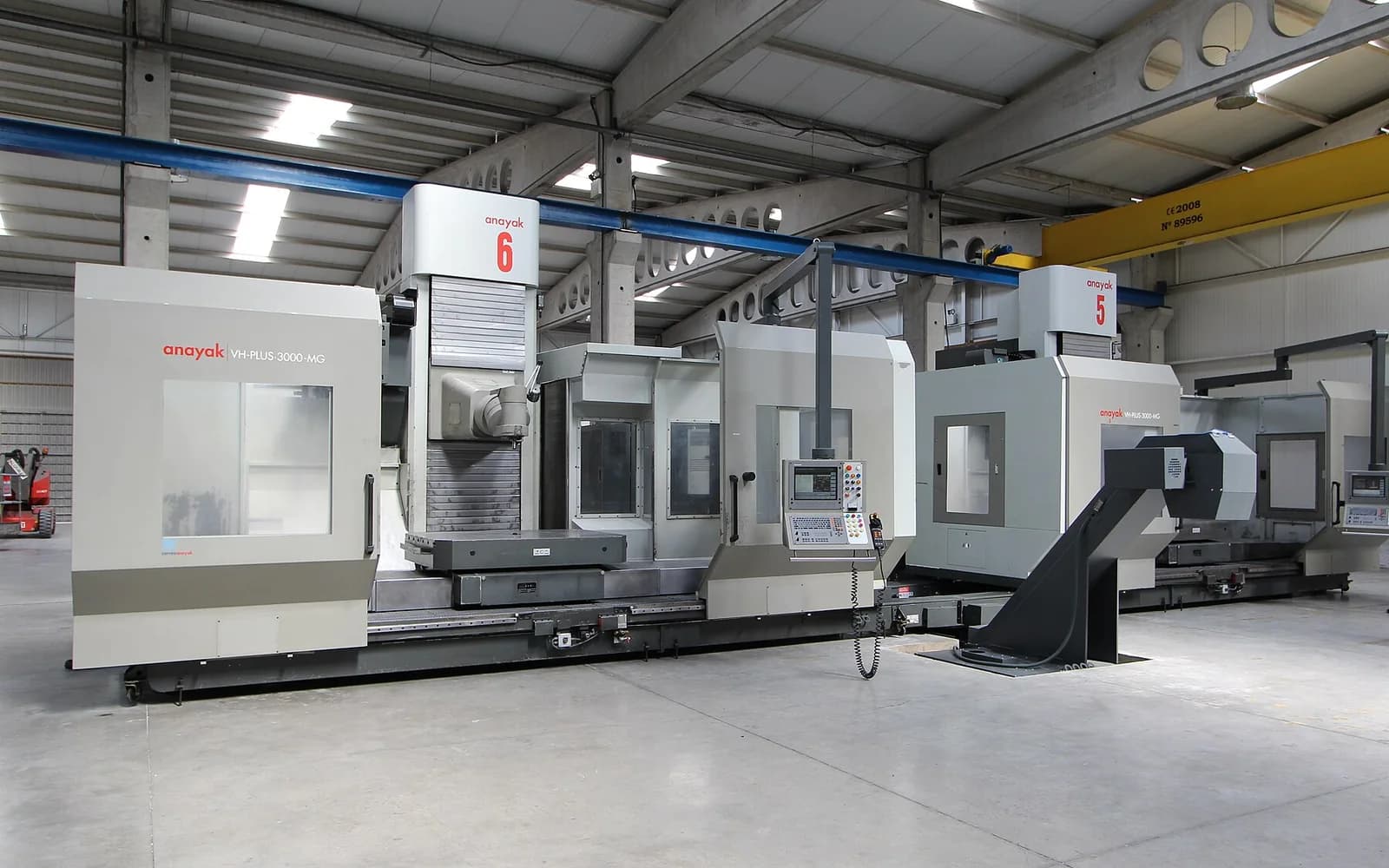 A line of CNC machining centres in a factory hall