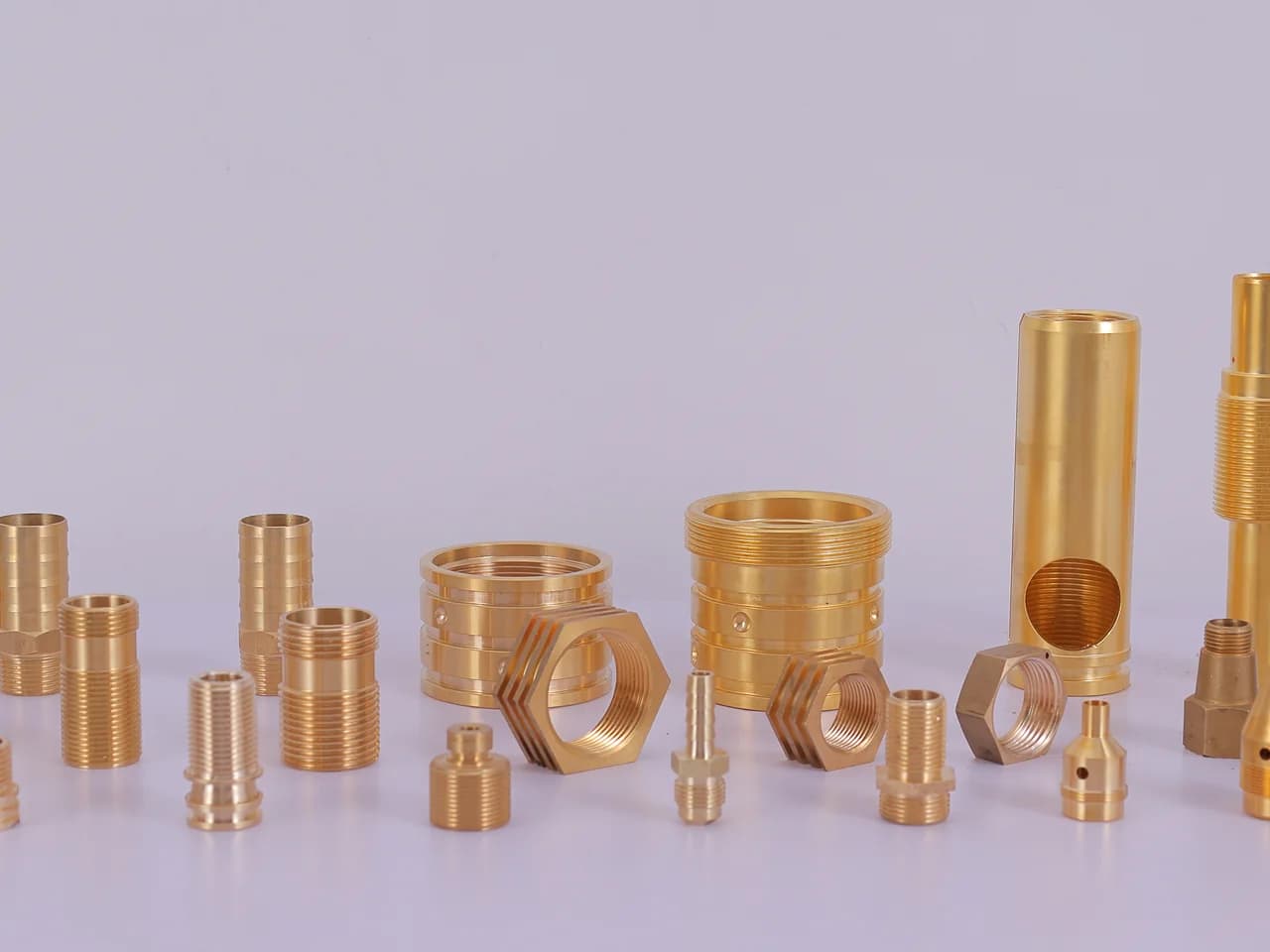 Brass hose nipples, hex nipples, reducing bushes and threaded couplings on the studio table